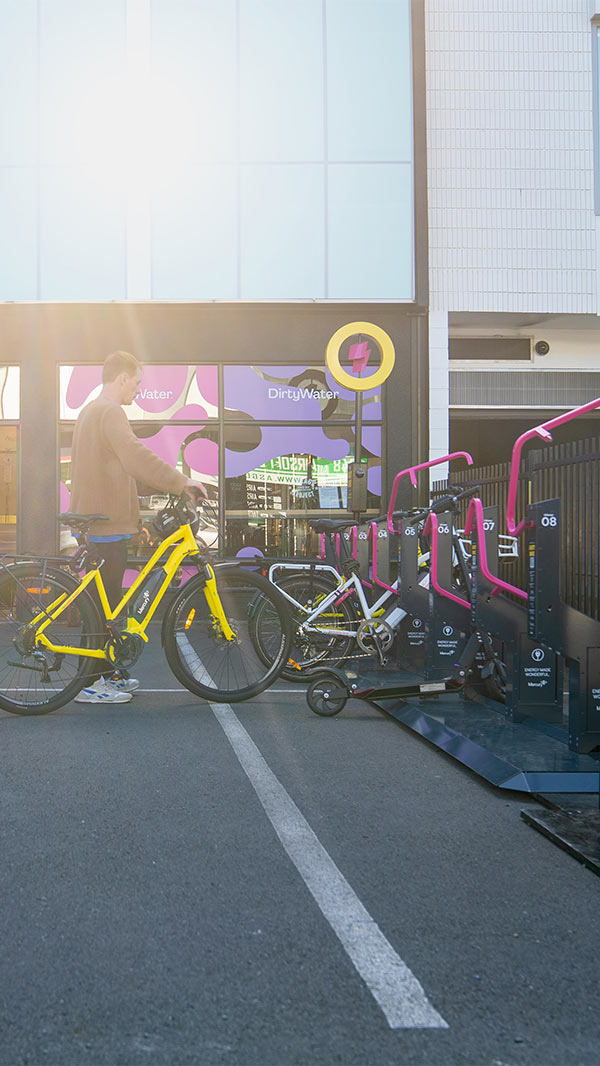 e.bike rider using locky dock free bike charging station