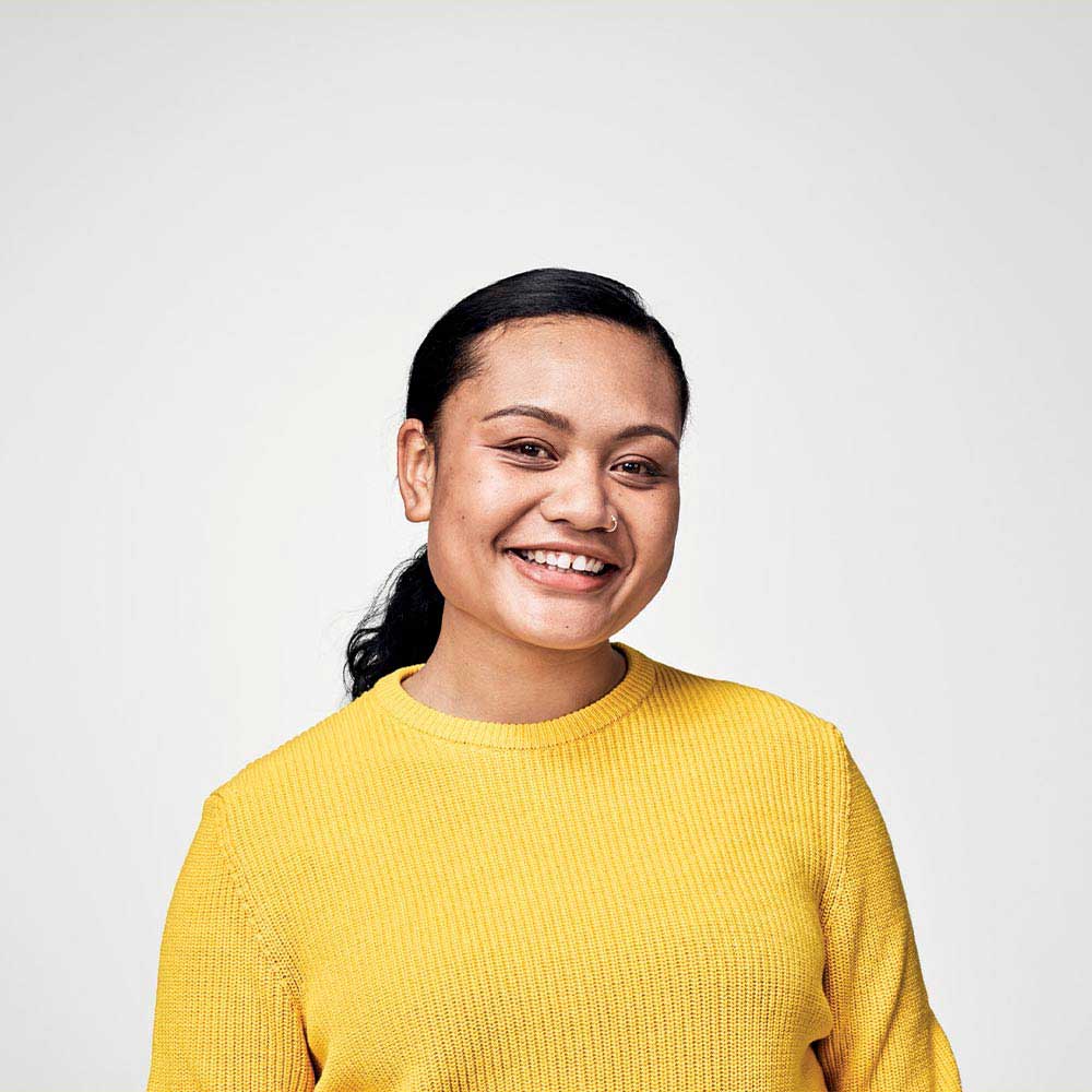 Women smiling in yellow top