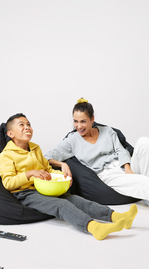 Mum and Child chill out on beanbags with popcorn