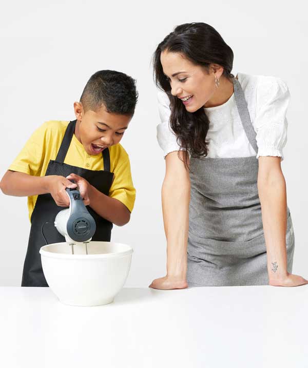 A boy and a women baking