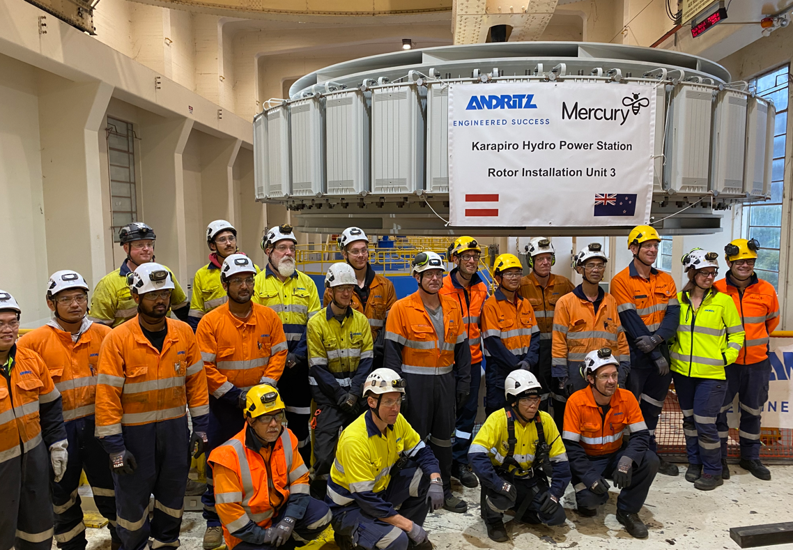 Group of people wearing PPE in front of Rotor installation