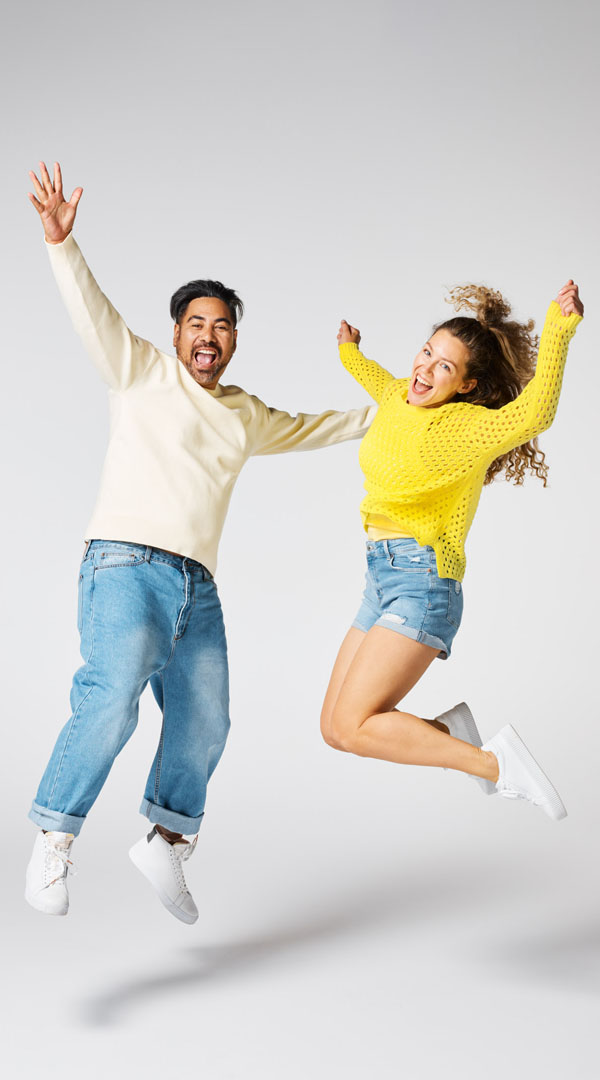 Man and Woman jumping happily